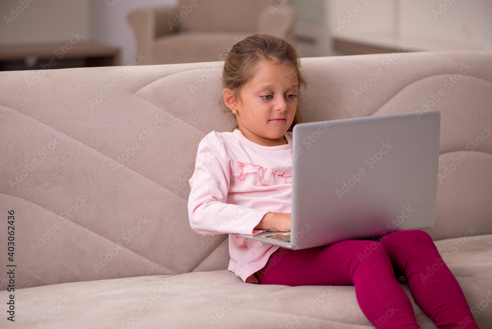 Small girl in tele-education concept at home Small girl in tele-education concept at home