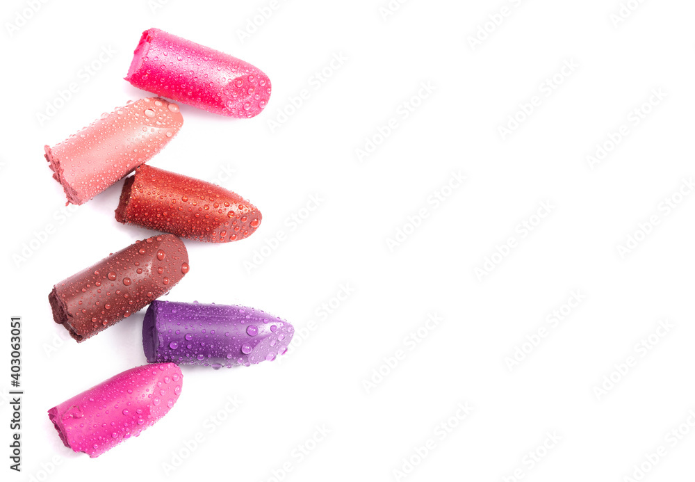 Six Tubes of Lipstick Broken and Isolated on a White Background Covered in Water Six Tubes of Lipstick Broken and Isolated on a White Background Covered in Water