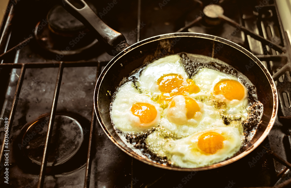 Fried eggs in the pan on the gas stove Fried eggs in the pan on the gas stove