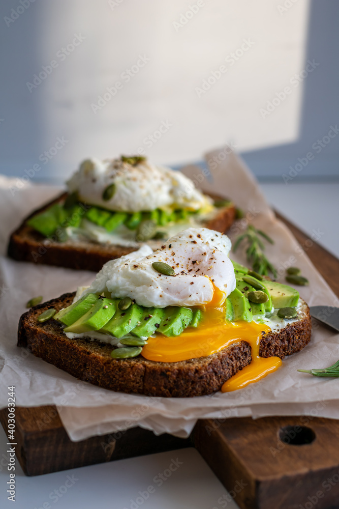 Two sandwiches with avocado and egg for breakfast