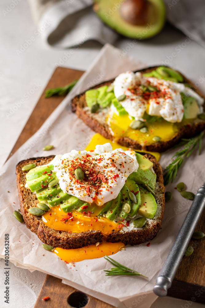 Two sandwiches with avocado and egg for breakfast Two sandwiches with avocado and egg for breakfast
