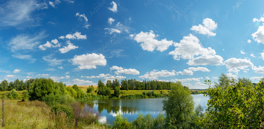 Obraz premium Bright summer landscape with beautiful lake and green hills 