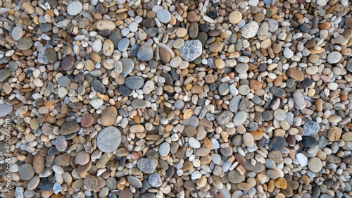 Pebbles on beach, close up background texture.