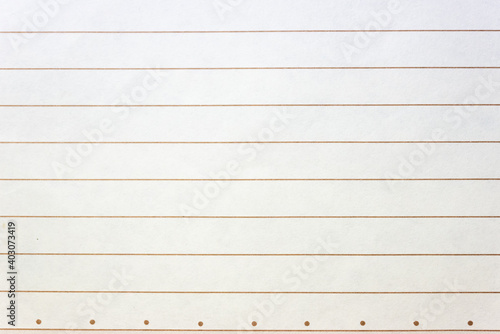 Rumpled lined sheet of paper isolated on white background. Lined textbook page texture with margin line. Empty and clean school notebook.
