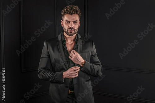 Fotografía Elegant,handsome man posing in black fashionable suit,