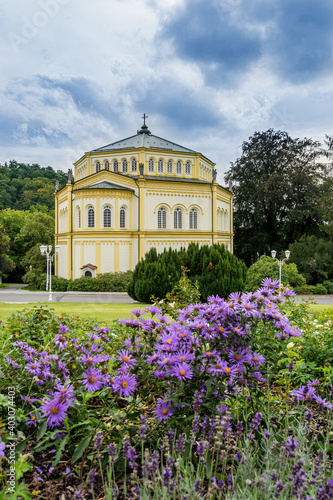 Catholic church with flowers - spa park in Marianske Lazne (Marienbad) - Czech Republic