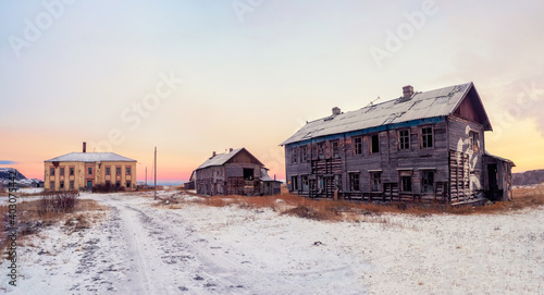 Abandoned house against the Arctic sky. Old authentic village of Teriberka. Kola Peninsula. Russia.