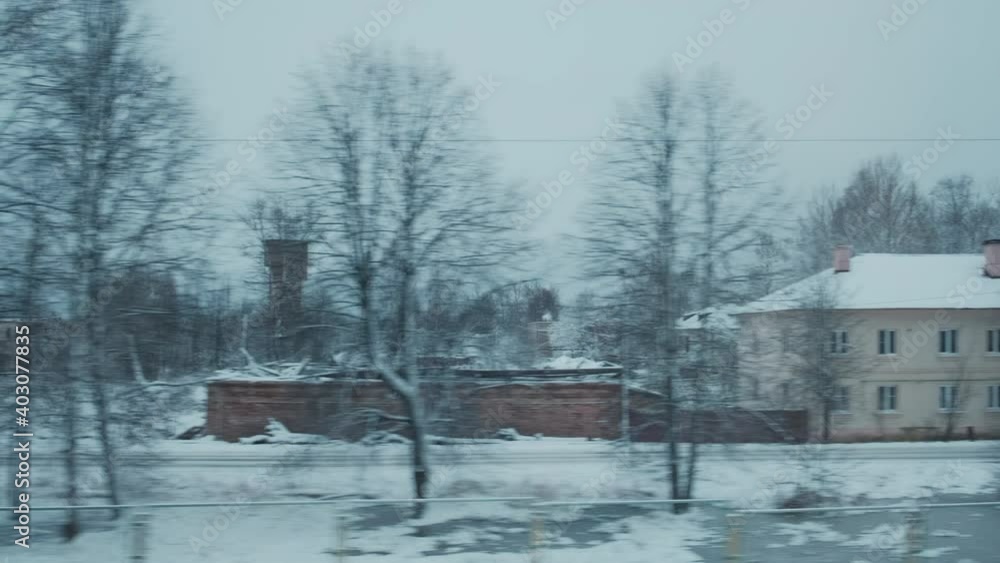 Moving along typical Russian small town in frozen winter, snow and ice. Pov tracking shot from train window. Moving along typical Russian small town in frozen winter, snow and ice. Pov tracking shot from train window.