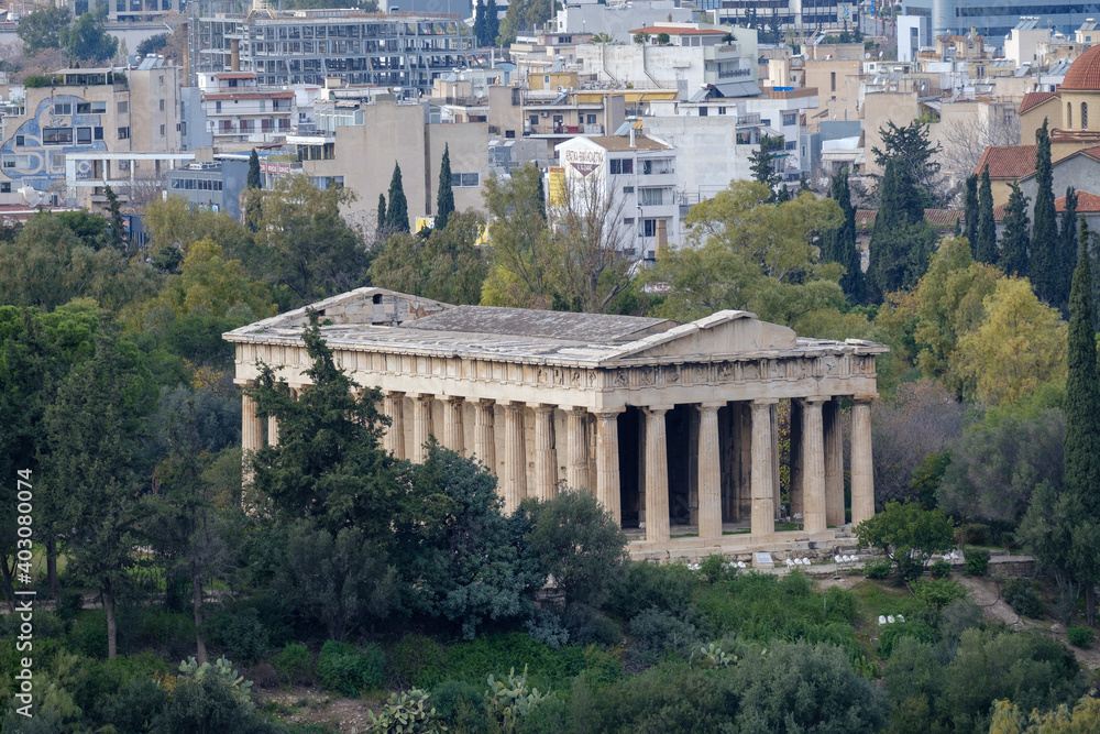 Athens - December 2019: view of Temple of Hephaestus with Athens in background Athens - December 2019: view of Temple of Hephaestus with Athens in background