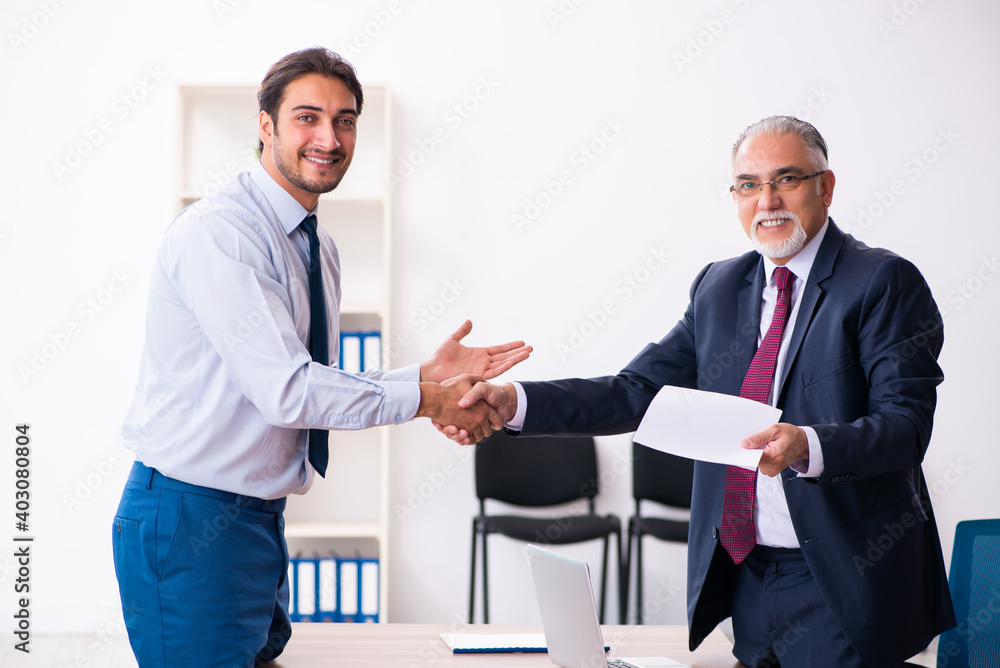 Young male candidate employee meeting with old recruiter Young male candidate employee meeting with old recruiter