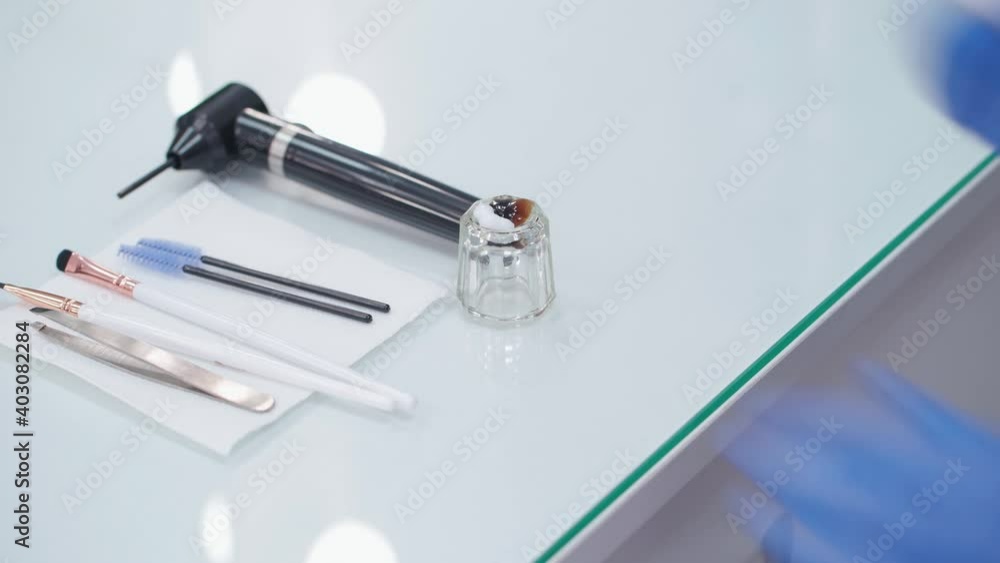 Eyebrow coloring. Brow designer adds an oxidizing agent to the paint. Eyebrow coloring. Brow designer adds an oxidizing agent to the paint.