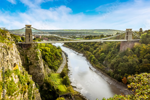 A view looking up the Avon gorge towards Bristol with the Clifton Suspension bridge across the gorge on a bright Autumn day photo