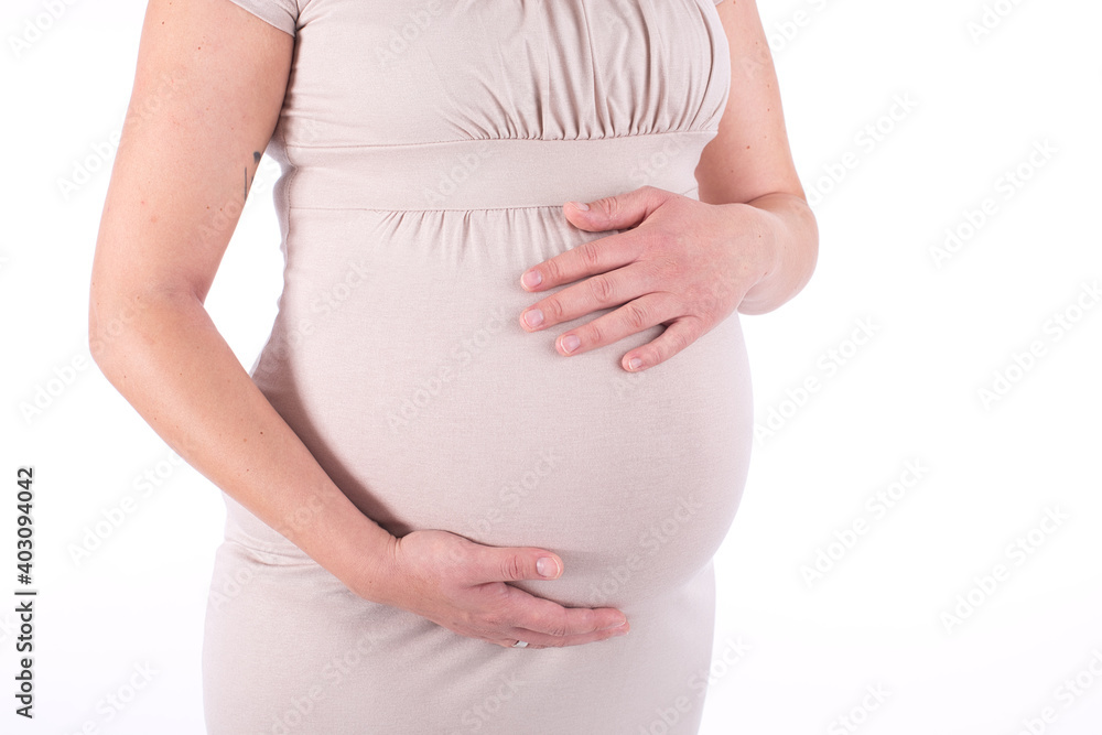 Close-up horisontal studio shoot of pregnant woman touching her belly. isolated on white background Close-up horisontal studio shoot of pregnant woman touching her belly. isolated on white background