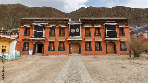 Orange colored house at Labrang monastery. Typical tibetan architecture.