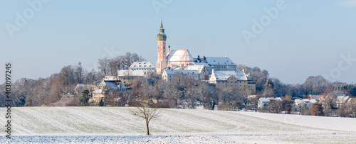 Amazing panorama of Andechs Abbey (Kloster Andechs) during winter season. Magical bavarian winter landscape with a historical benedictine monastery.