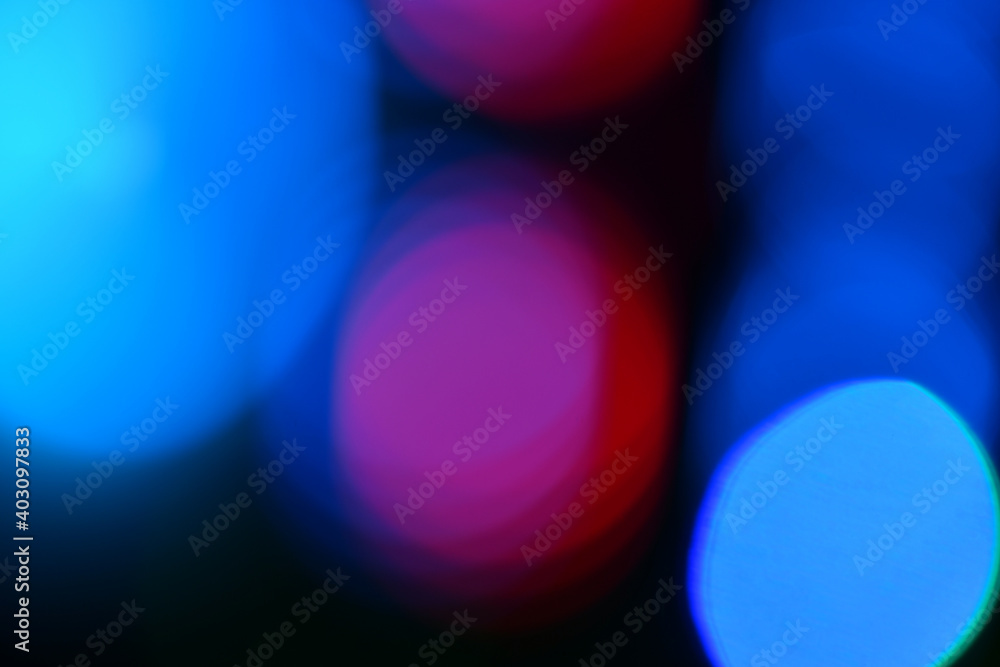 Multi-colored gradient circles on a dark background. Abstract blurred background. Multi-colored gradient circles on a dark background. Abstract blurred background.