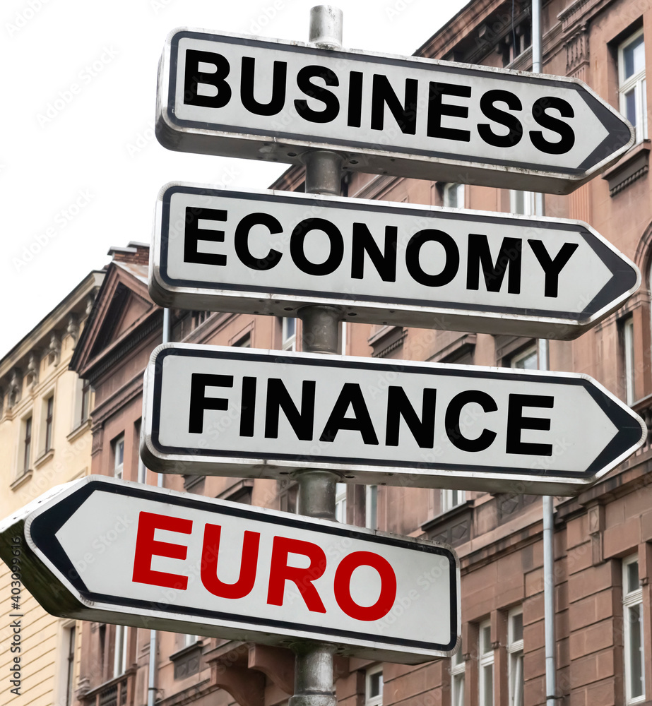 The road indicator on the arrows of which is written - business, economics, finance and EURO The road indicator on the arrows of which is written - business, economics, finance and EURO