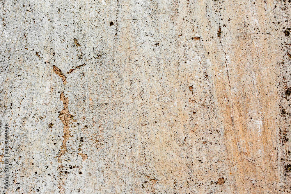 Texture of a concrete wall with cracks and scratches which can be used as a background Texture of a concrete wall with cracks and scratches which can be used as a background