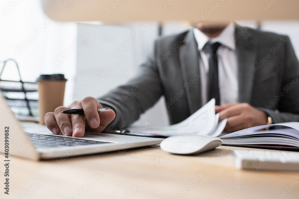cropped view of trader using laptop at workplace on blurred foreground, banner cropped view of trader using laptop at workplace on blurred foreground, banner