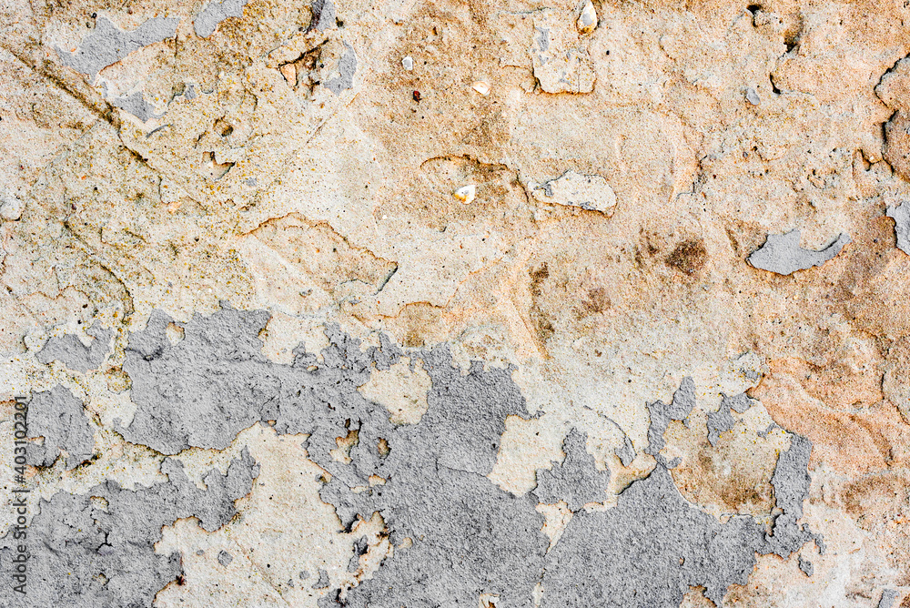 Texture of a concrete wall with cracks and scratches which can be used as a background Texture of a concrete wall with cracks and scratches which can be used as a background