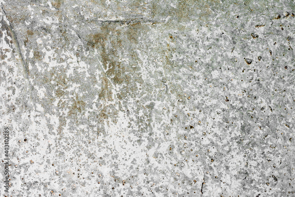 Texture of a concrete wall with cracks and scratches which can be used as a background Texture of a concrete wall with cracks and scratches which can be used as a background