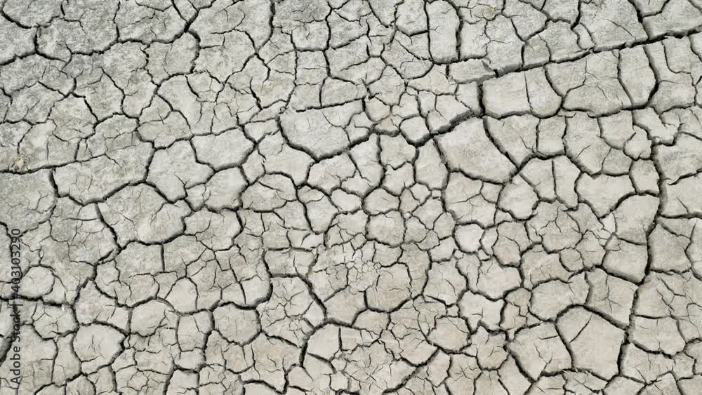 Empty dry lake bed with cracked ground. Global warming concept. Death valley field. Flat desert plain landscape, dried up reservoir, barren earth shattering Empty dry lake bed with cracked ground. Global warming concept. Death valley field. Flat desert plain landscape, dried up reservoir, barren earth shattering
