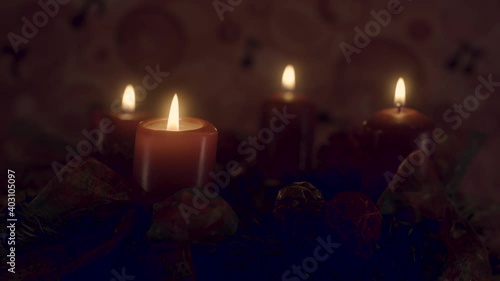 Closeup of an advent wreath with four candles burning, then extinguished