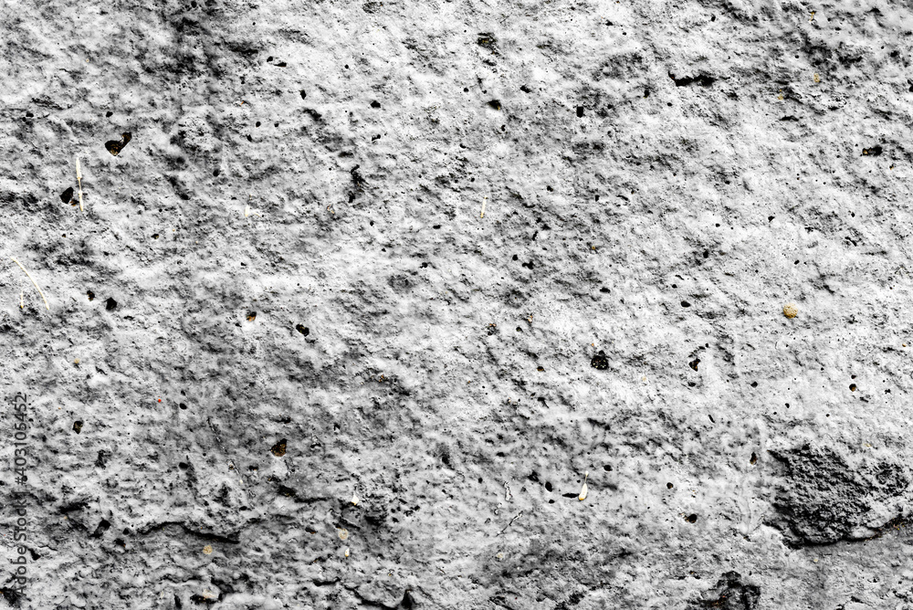 Texture of a concrete wall with cracks and scratches which can be used as a background Texture of a concrete wall with cracks and scratches which can be used as a background