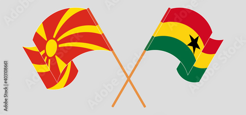 Crossed and waving flags of North Macedonia and Ghana