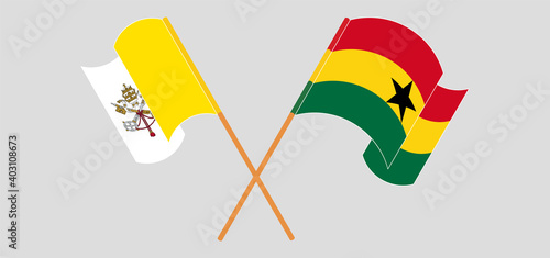 Crossed and waving flags of Vatican and Ghana