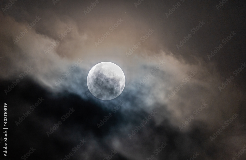 Full moon through the clouds!