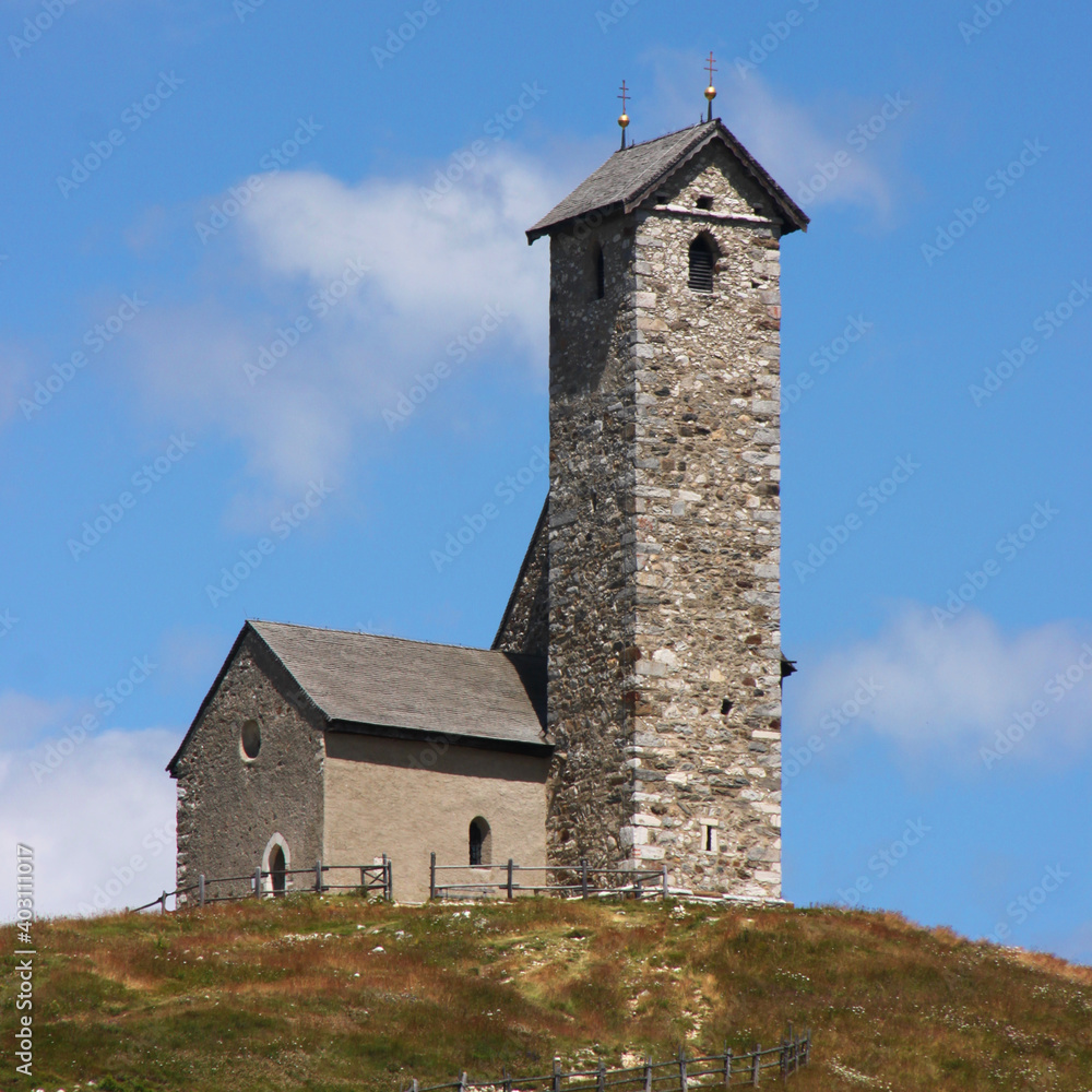 Small romanesque mountain church of St Vigil am Joch, Lana village in the Alps, South Tyrol in Italy