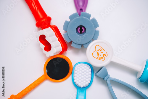Toy kids dental instruments on white background, kids room in hospital