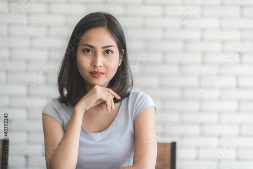 young Asian woman smiling t...