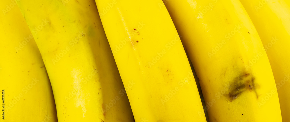 macro photo of yellow bananas. background or textura