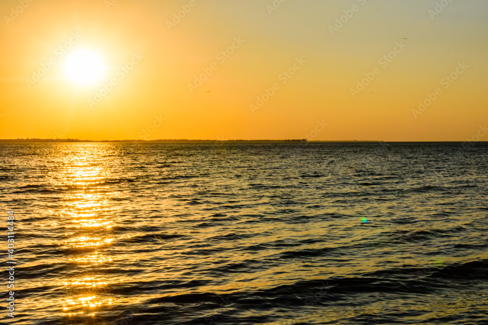 Obraz premium View on a Kremenchug reservoir at sunset. Summer landscape