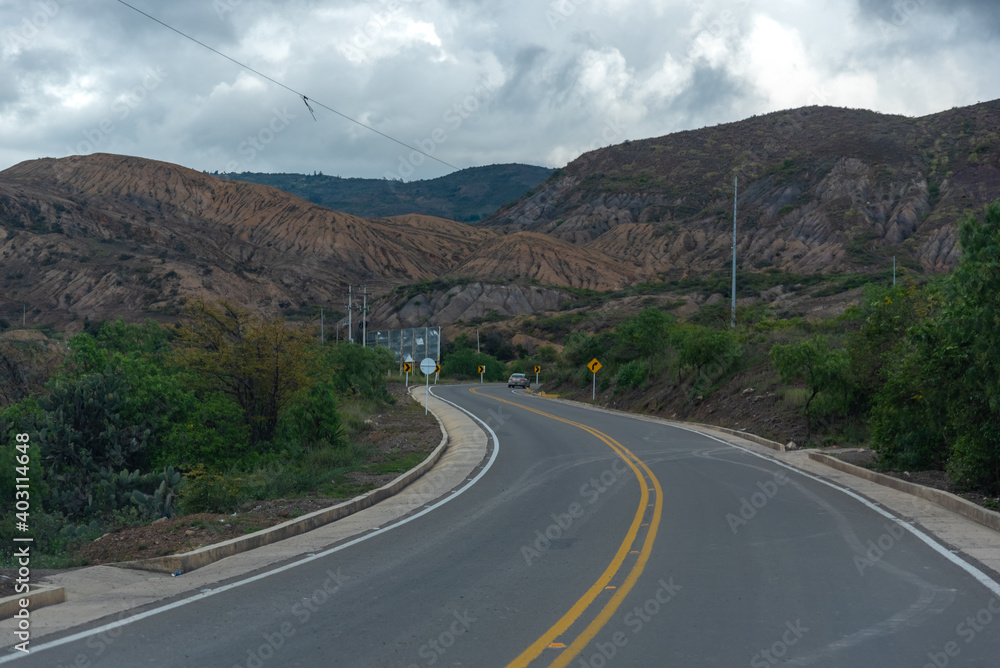 Curve in a road between mountains with a semi-dry climate in the department of Boyaca. Colombia.