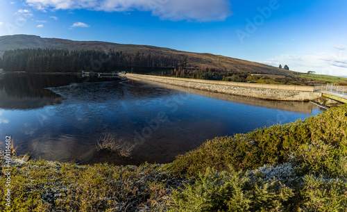 Thin ice on Fofanny reservoir and dam, Mourne mountains, County Down, Northern Ireland, panorama