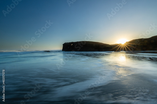 Sunrise at one of the most famous beaches in Spain  Las Catedrales 