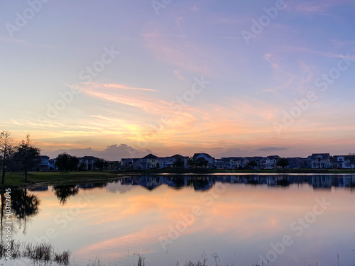 Beautiful pink, orange and blue sunset reflecting on a lake.