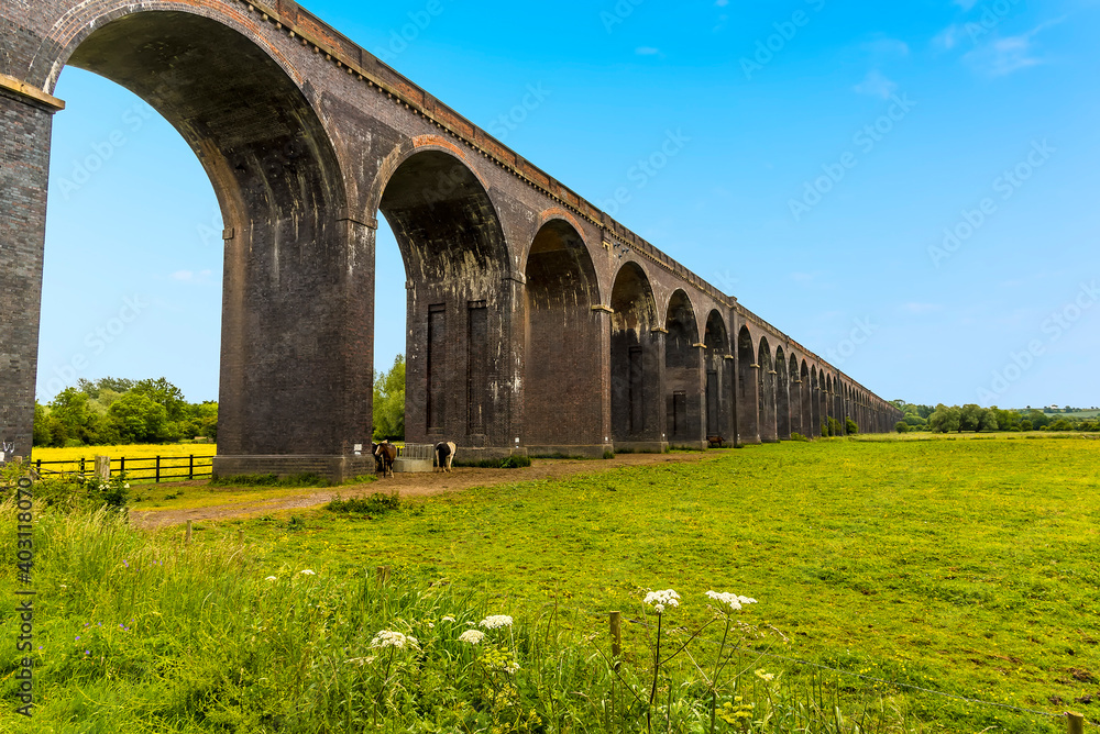 A view along the side of the Harringworth railway viaduct, the longest masonry viaduct in the UK