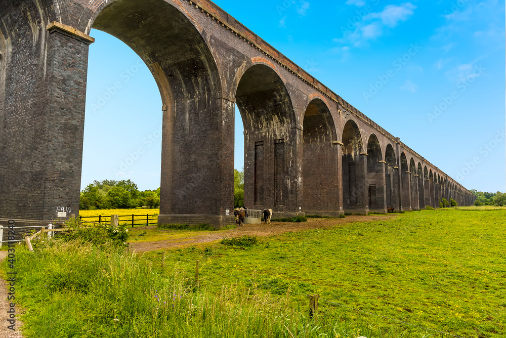 A close up view along the side of the Harringworth railway viaduct, the longest masonry viaduct in the UK
