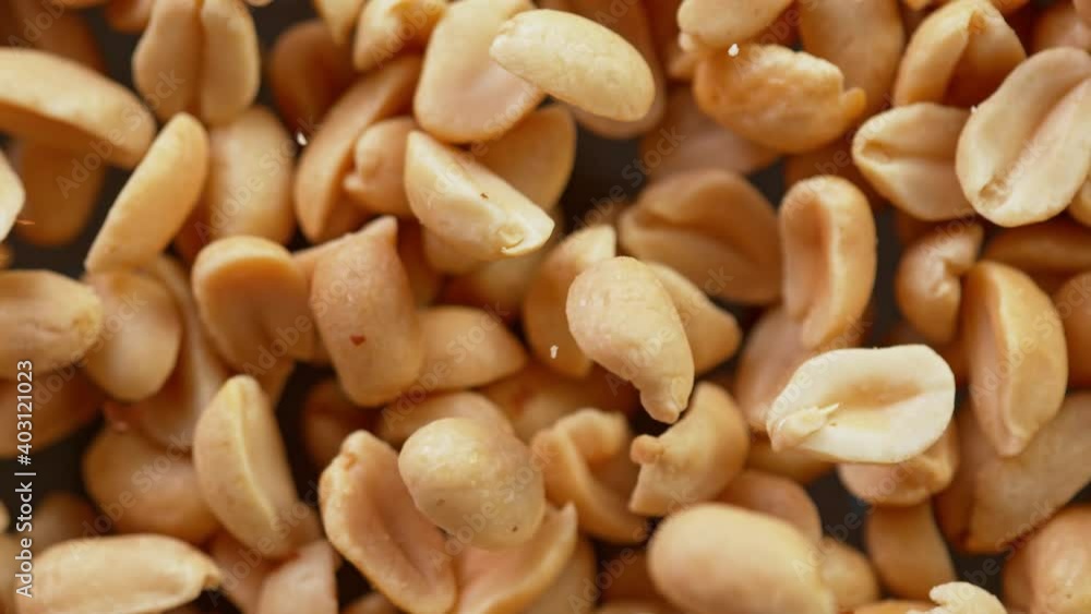 Super Slow Motion Detail Shot of Rotating Peanuts at 1000 fps. Super Slow Motion Detail Shot of Rotating Peanuts at 1000 fps.