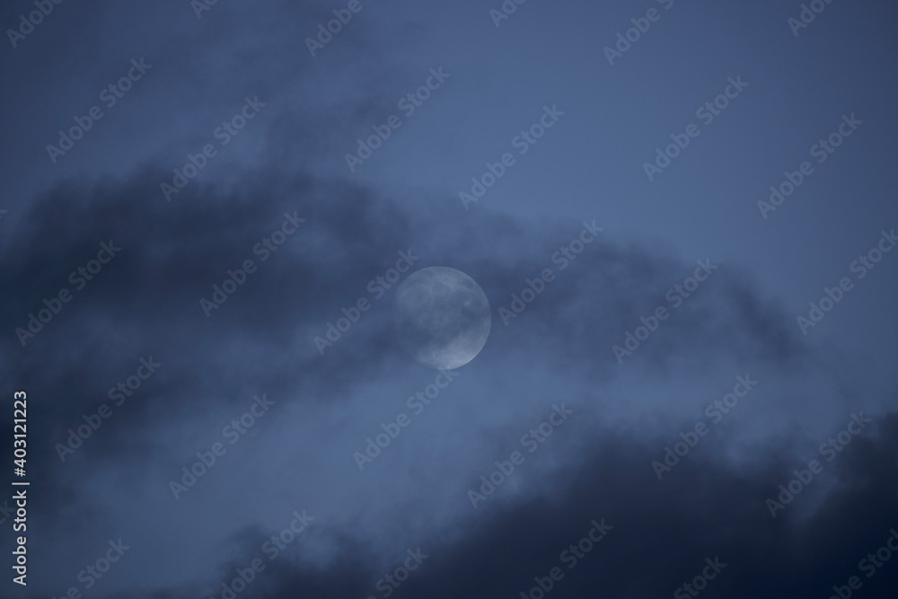 Moon in the cloudy sky