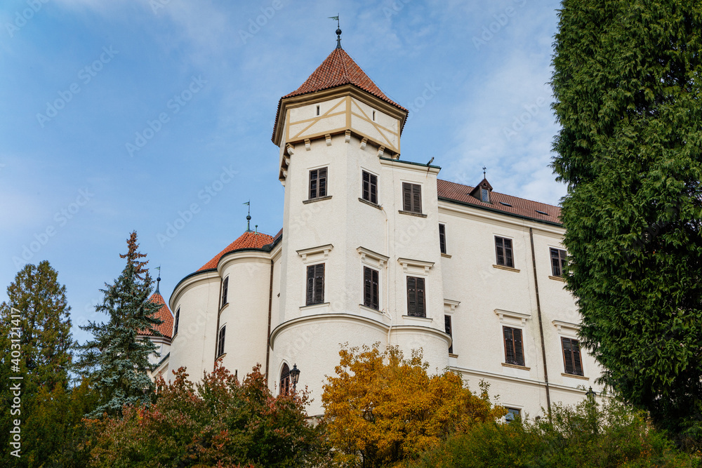 Historic Medieval Konopiste castle residence of Habsburg imperial family, white tower and park of romantic gothic baroque Chateau in autumn sunny day, Central Bohemia, Czech Republic,