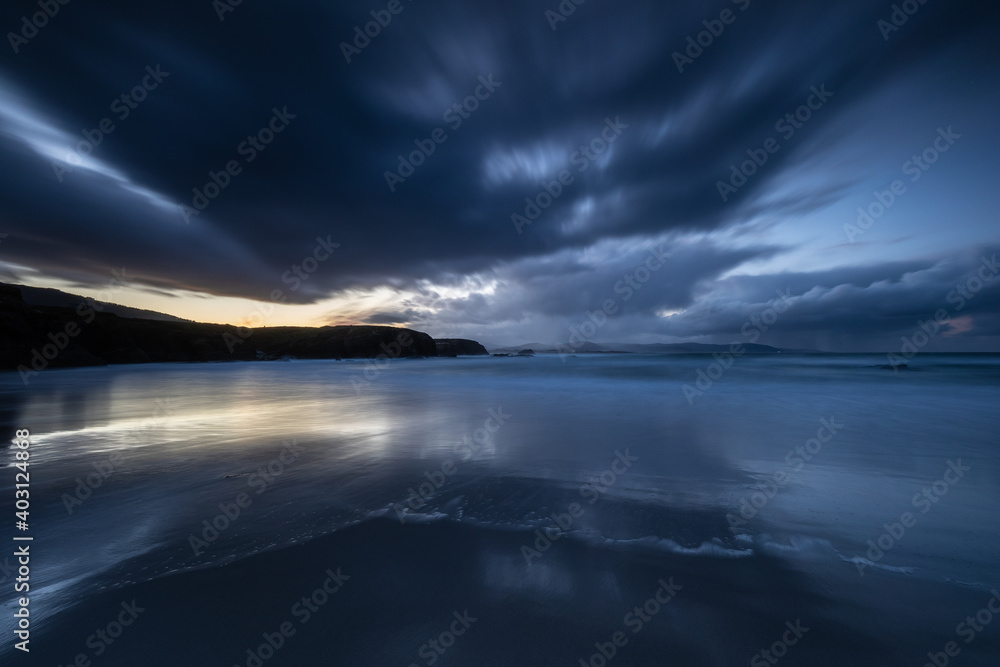 Fototapeta premium Winter sunset with reflections of clouds on the beach of Las Islas!
