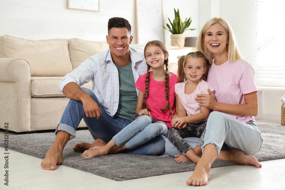 Portrait of happy family on floor at home Portrait of happy family on floor at home