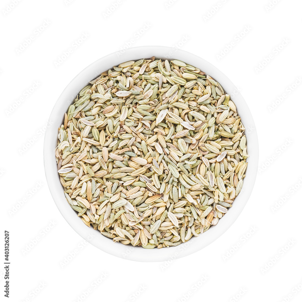 Fennel seeds in round bowl isolated over white background.