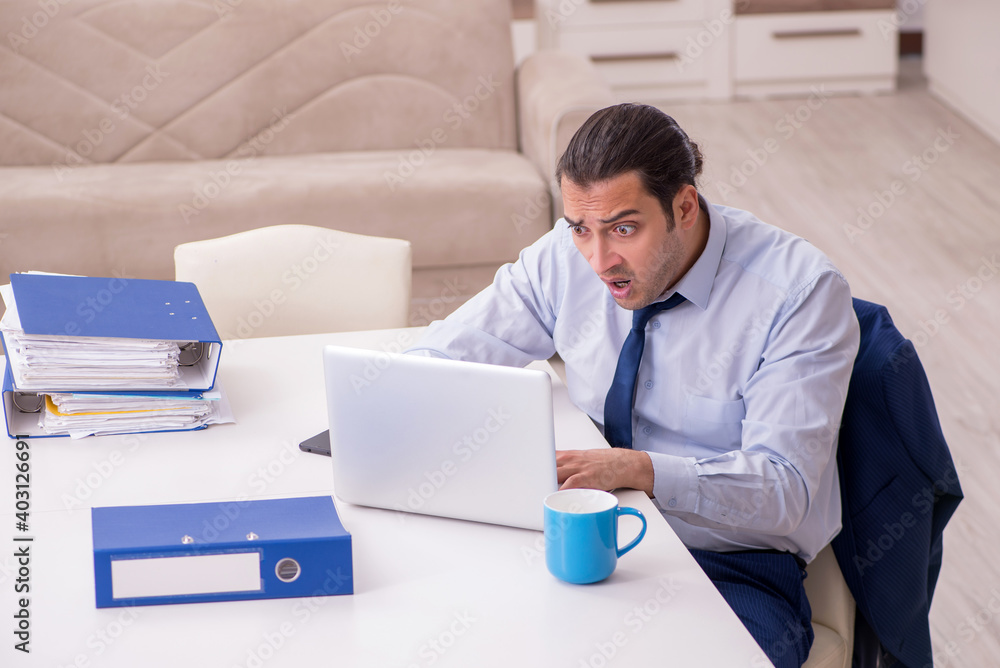 Young male employee working from home in pandemic concept Young male employee working from home in pandemic concept
