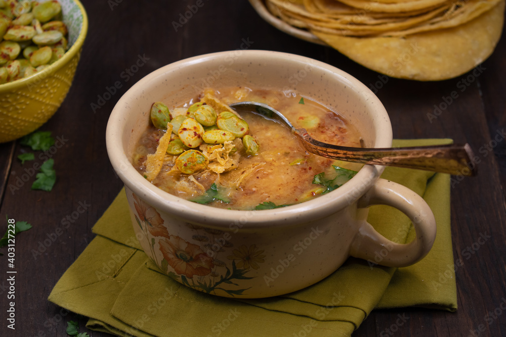 Vegan yellow pea soup topped with lima beans, corn tortillas, Vegan yellow pea soup topped with lima beans, corn tortillas,